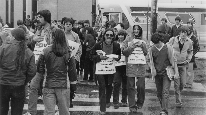 A photo of student protestors in 1980 on the crosswalk after student Judy Lynn Ford was killed by a vehicle crossing Prince Philip Parkway